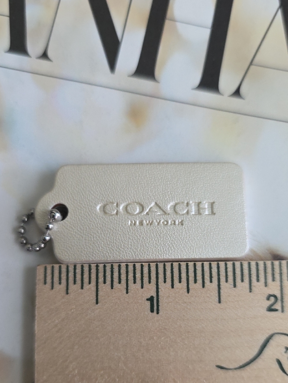 Coach Leather Bag Tag in Pearlescent White with Silver Ball Chain